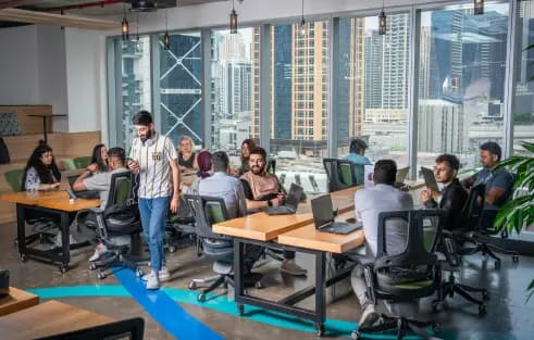GPS Marketing team at work with a view of Dubai